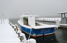 boat at dock in snow